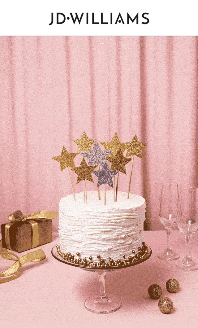 Personalised, animated JD Williams birthday hero: a white birthday cake with a gold glitter topper reading Happy Birthday Laura